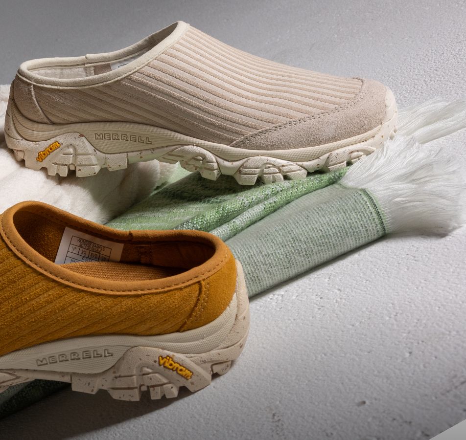 Person tying Merrell running shoes